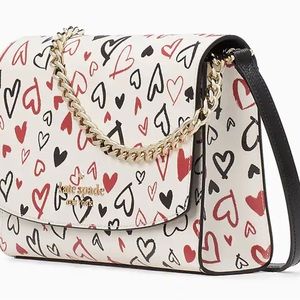 Brand new Kate Spade clutch with crossbody strap option.